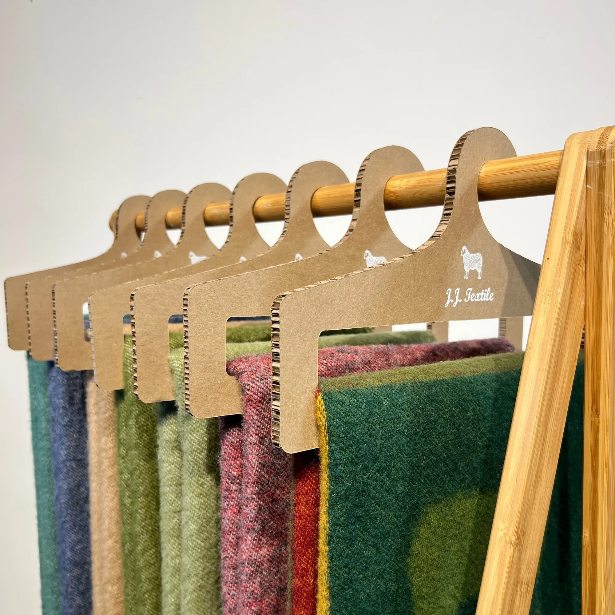 J.j. Textile Cardboard Hangers Detail 1 J.j. Textile Cardboard Hangers Detail 1